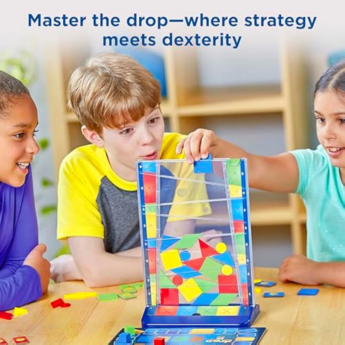Thames & Kosmos Drop It, Competitive Game, Family Games for Game Night, Strategy Board Games for Adults and Kids, For 2 to 4 Players, Age 8+