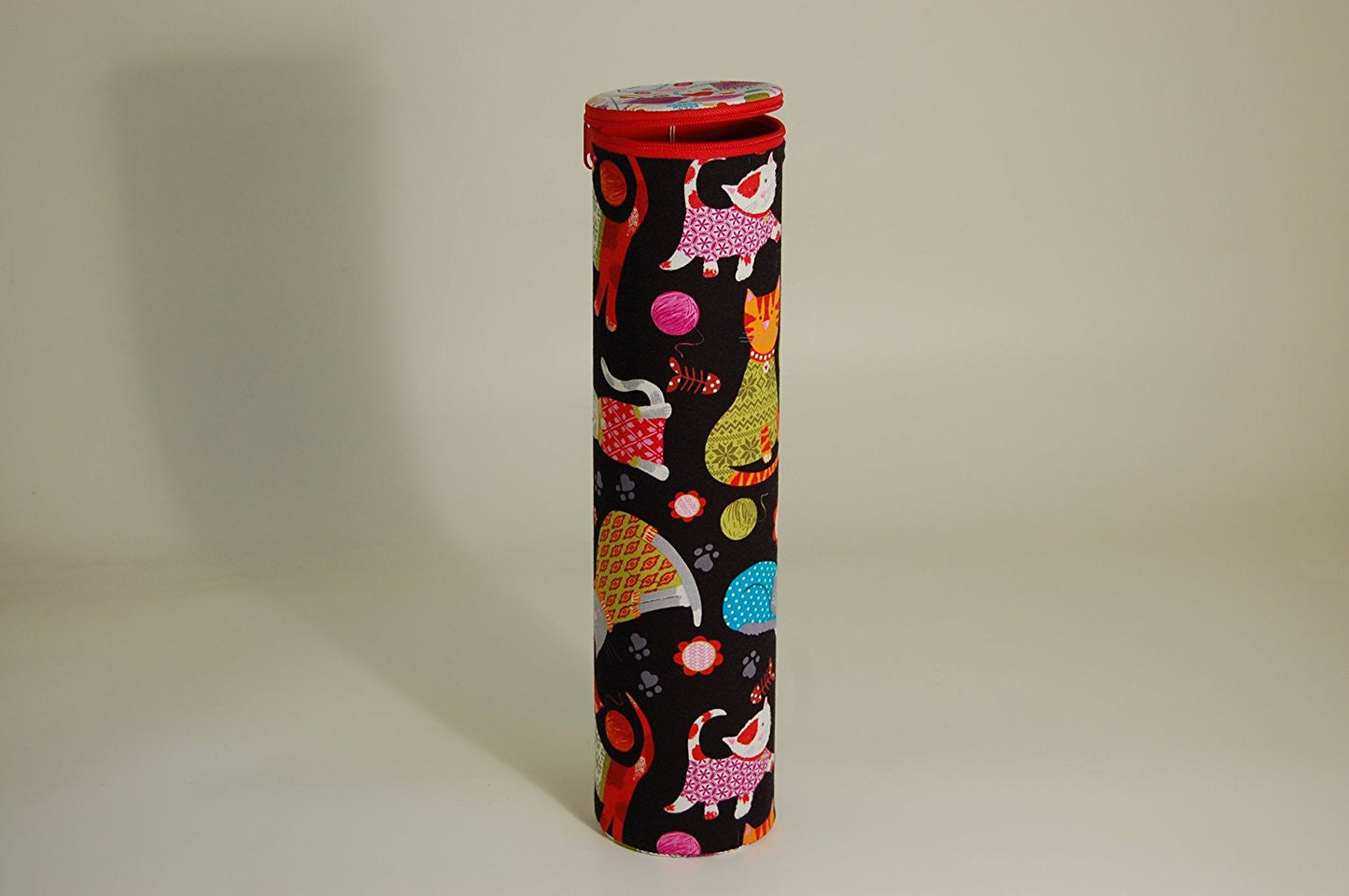 Knitting Pin holder - cylinder shape tube - fabric shows cartoon cats design on a dark background