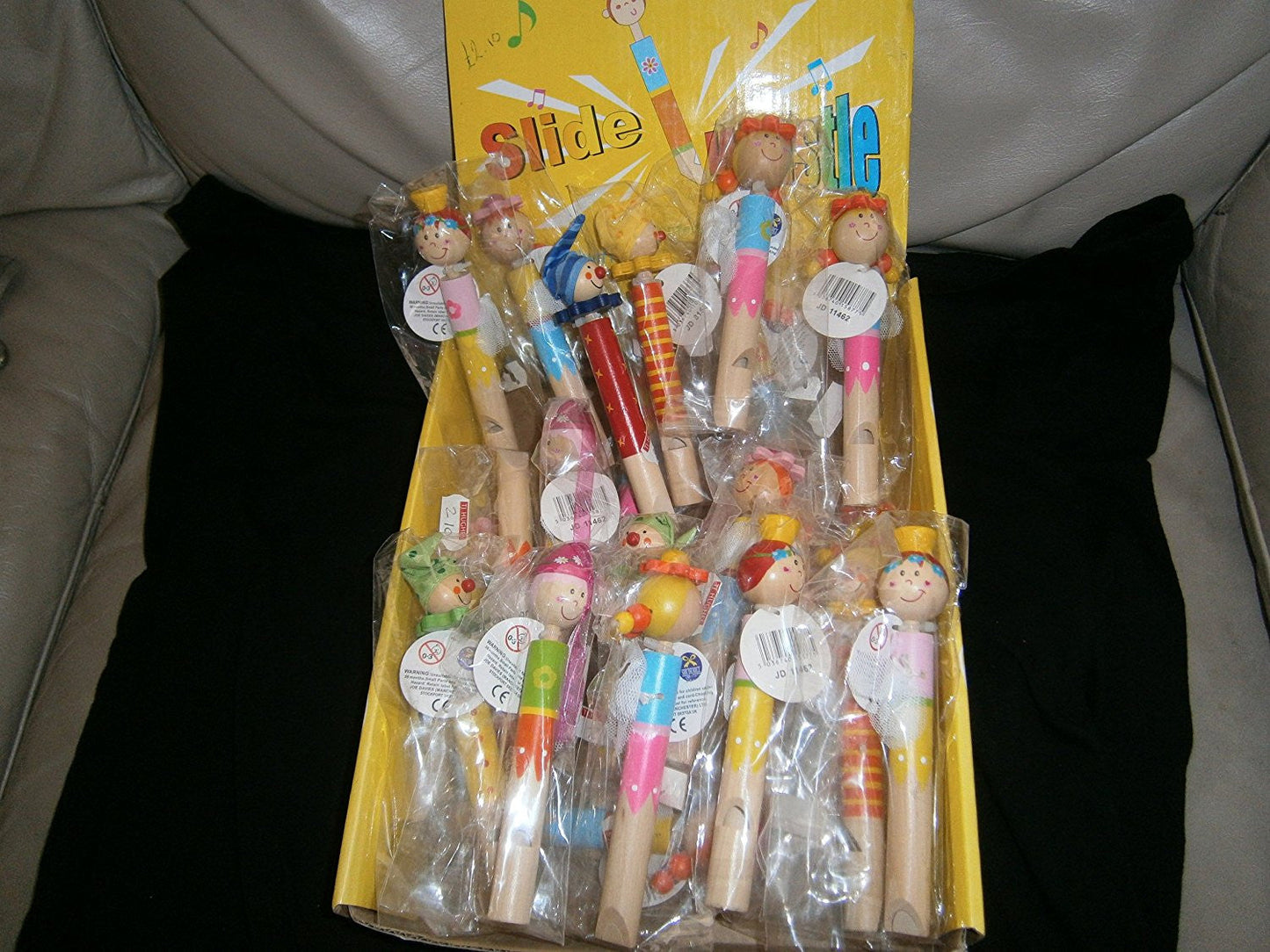 slide clown whistle various colours/faces one supplied