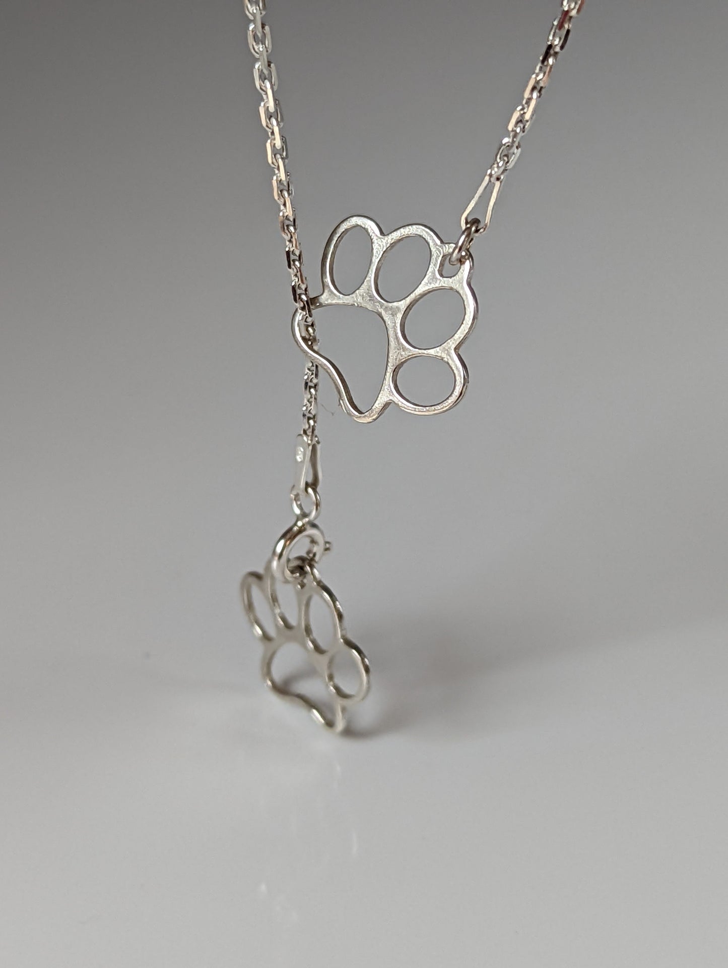 Silver Steed Thread Through Double Paw Print Silver Necklace