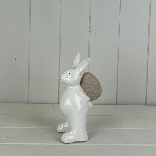 Ceramic White Rabbit holding an Egg H14.4cm W7.5cm D7.5cm Weight-149g