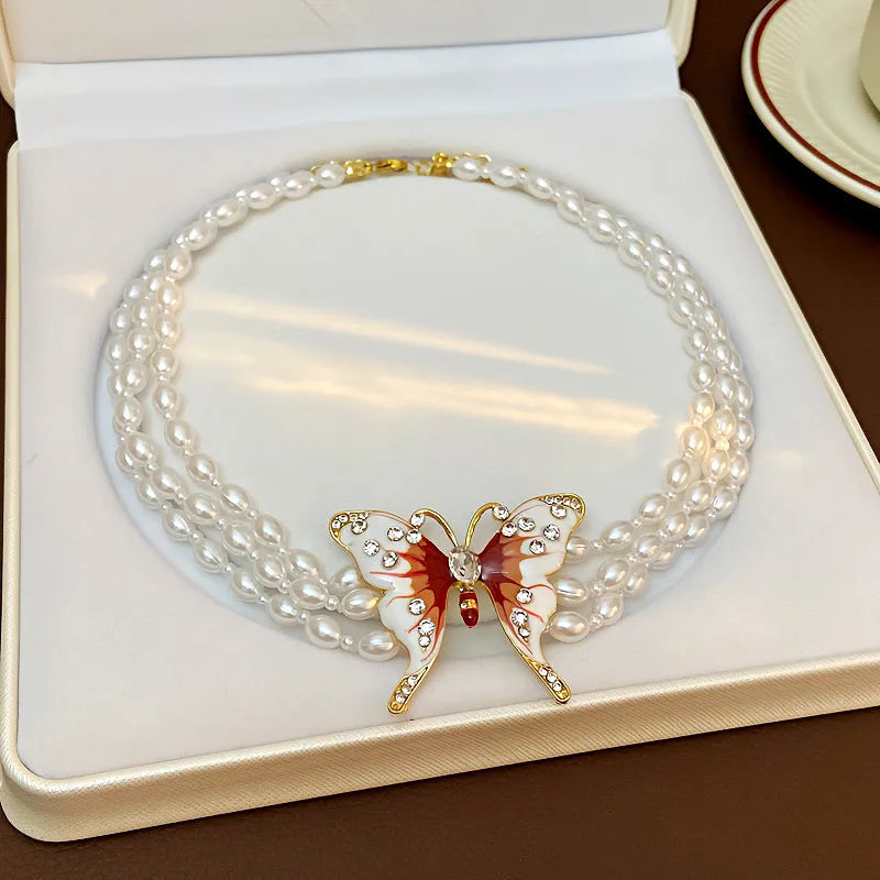 Vacation Classic Style Butterfly Imitation Pearl Alloy Beaded Chain Beaded Necklaces Wholesale