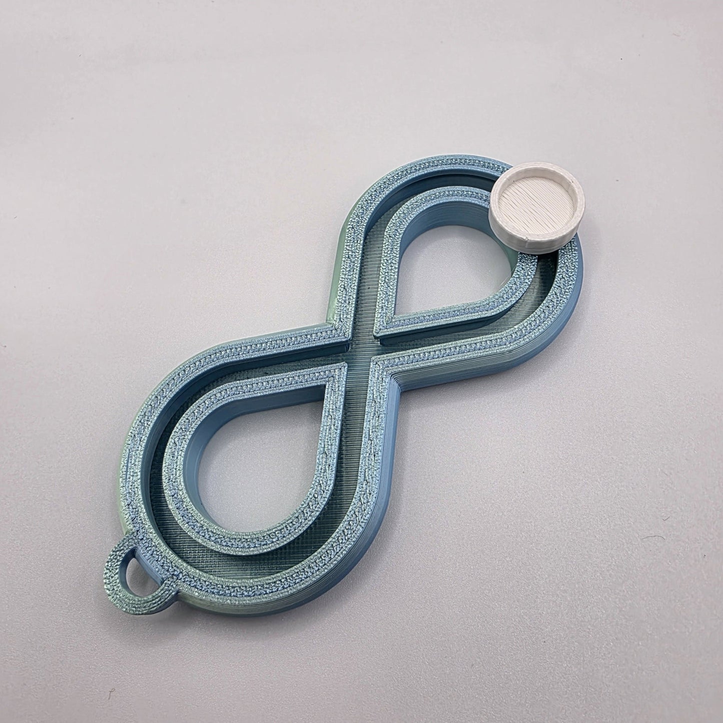 3dFidgets - Infinite Breath a soothing, figure-eight fidget tool designed to help you slow down, regulate your breathing, and find calm anytime, anywhere
