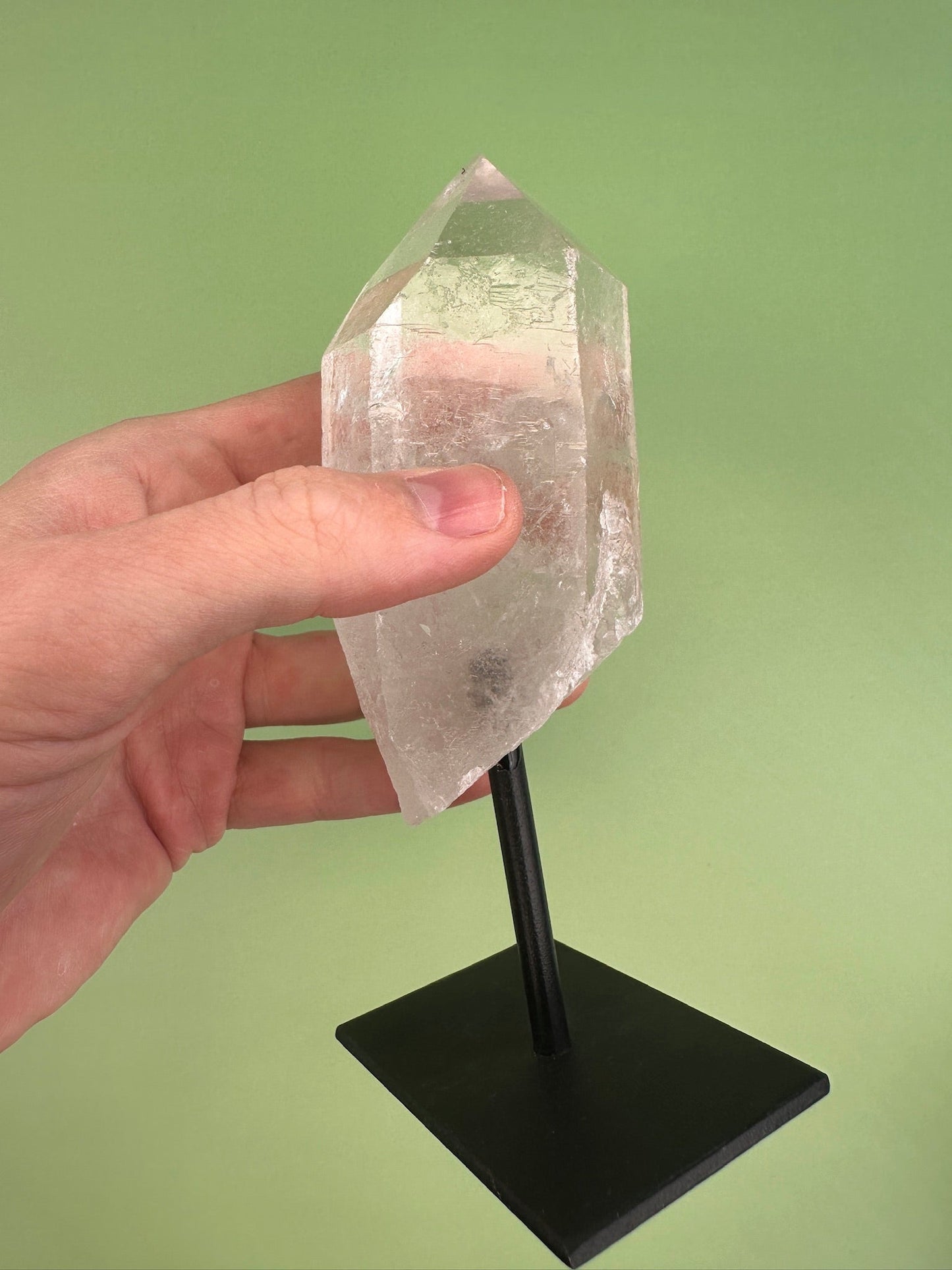 Clear quartz - Rough point on a stand