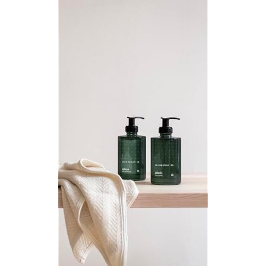 Skandinavisk SKOG ‘Forest’ Hand & body lotion, Scent notes: Pine needles and fir cones, birch sap and woodland lily of the valley, Coloured glass bottle with pump, 200 ml