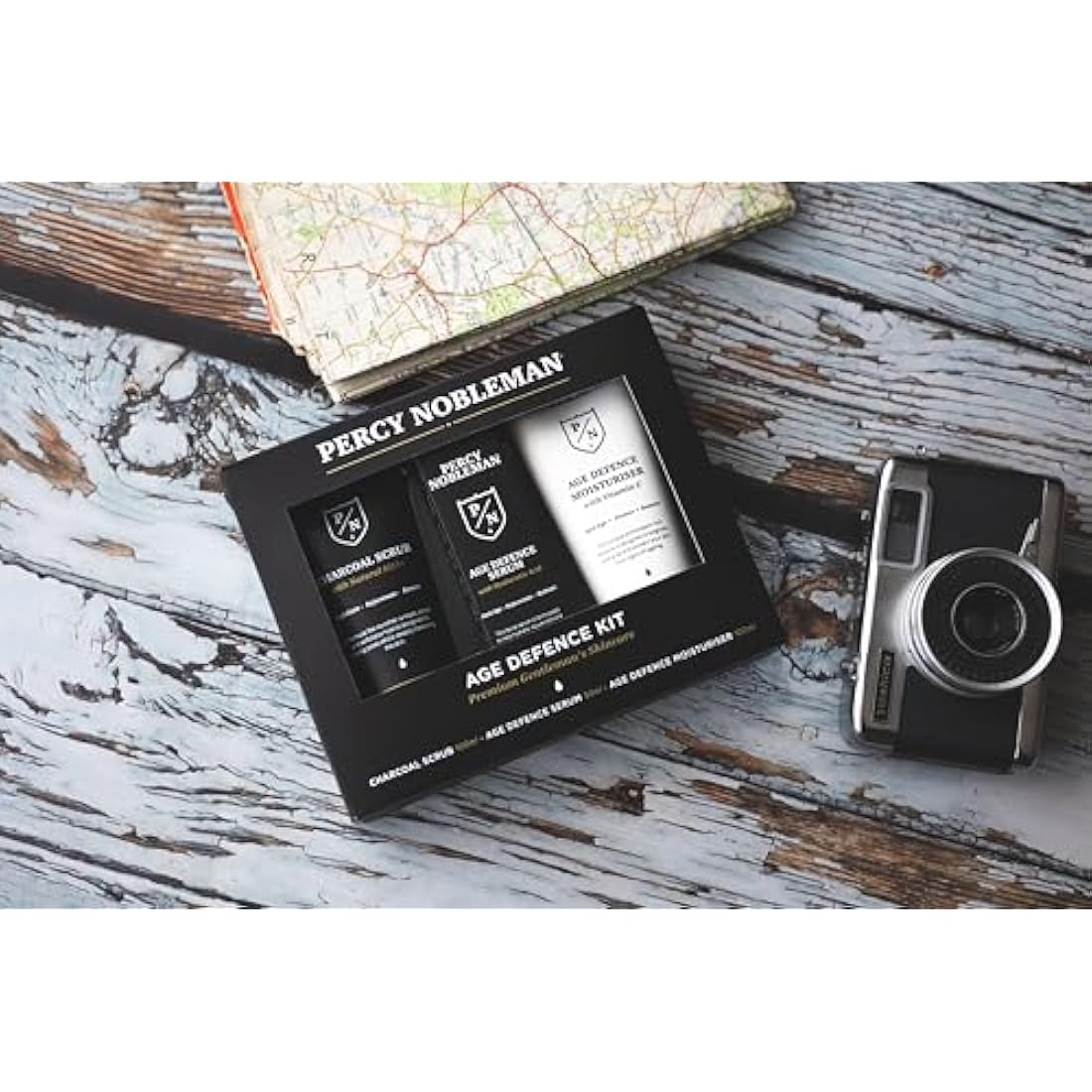Percy Nobleman Age Defence Kit, a men's skincare set containing Charcoal Face Scrub (with Natural AHAs), ultra-hydrating Facial Serum (with Hyaluronic Acid), and Moisturiser (with Vitamin C)