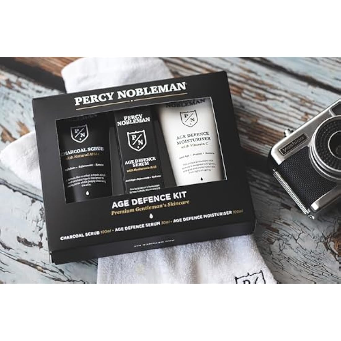 Percy Nobleman Age Defence Kit, a men's skincare set containing Charcoal Face Scrub (with Natural AHAs), ultra-hydrating Facial Serum (with Hyaluronic Acid), and Moisturiser (with Vitamin C)