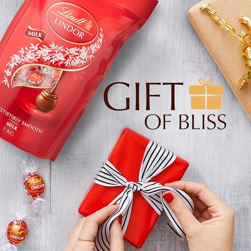 Lindt Lindor Milk Chocolate Truffles Bag - Approx 80 balls, 1kg - Chocolate Truffles with a Smooth Melting Filling - Gift Present or Sharing Box - Easter, Birthday, Congratulations