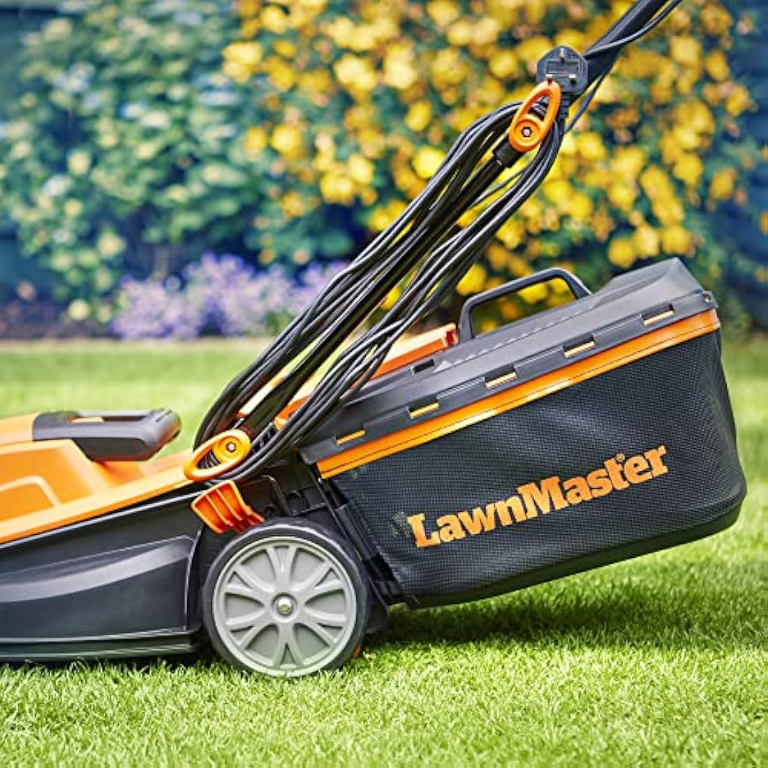 LawnMaster 1400W Electric Lawn Mower with 34cm cutting width, ideal for small to medium sized lawns. With 6 adjustable cutting heights and rear roller for striped finish, 2 year guarantee