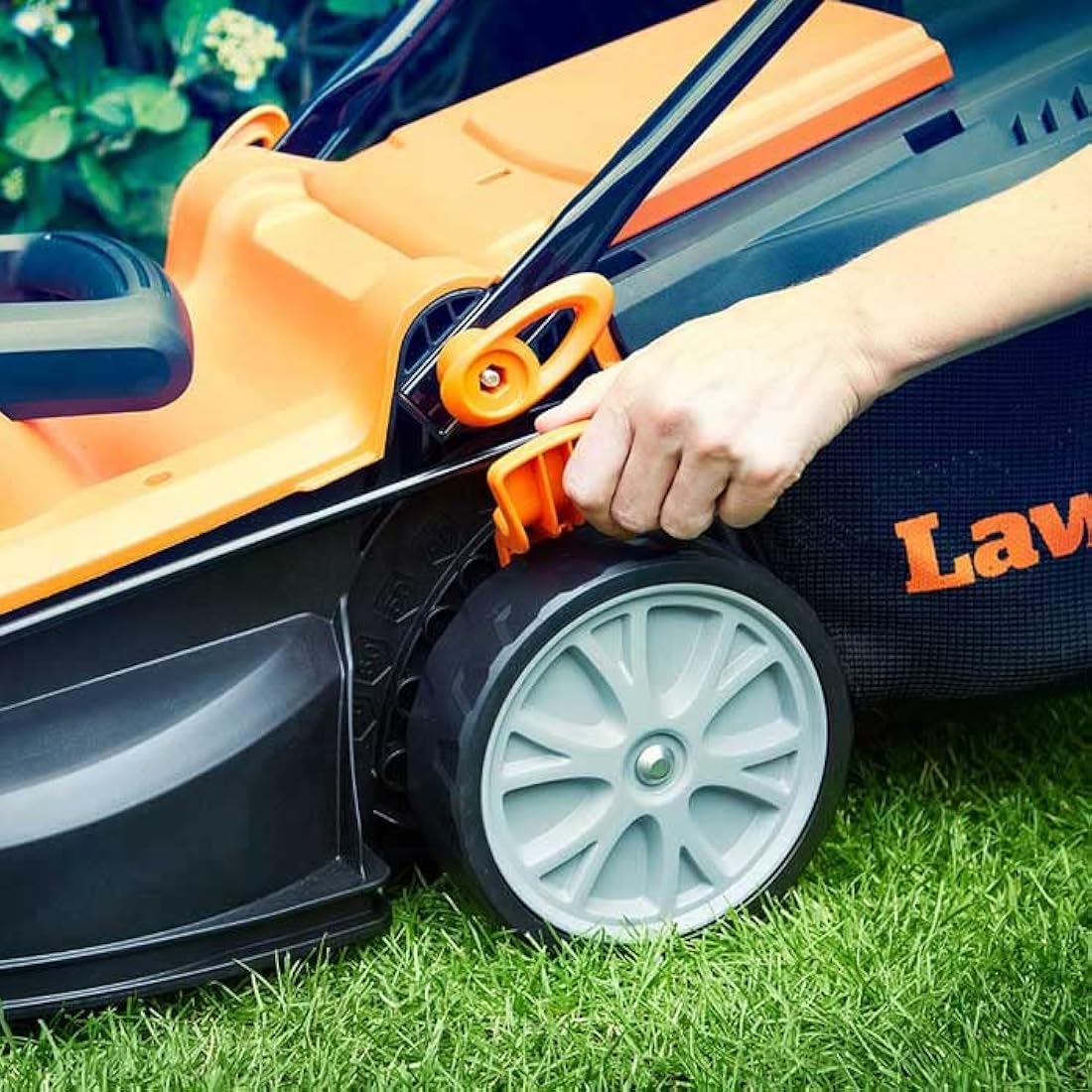 LawnMaster 1400W Electric Lawn Mower with 34cm cutting width, ideal for small to medium sized lawns. With 6 adjustable cutting heights and rear roller for striped finish, 2 year guarantee