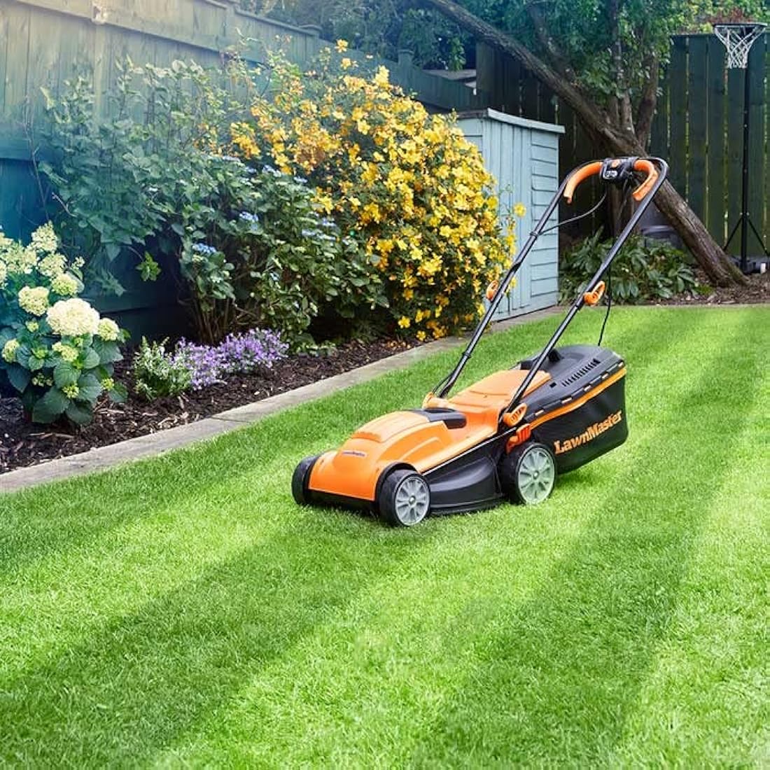 LawnMaster 1400W Electric Lawn Mower with 34cm cutting width, ideal for small to medium sized lawns. With 6 adjustable cutting heights and rear roller for striped finish, 2 year guarantee