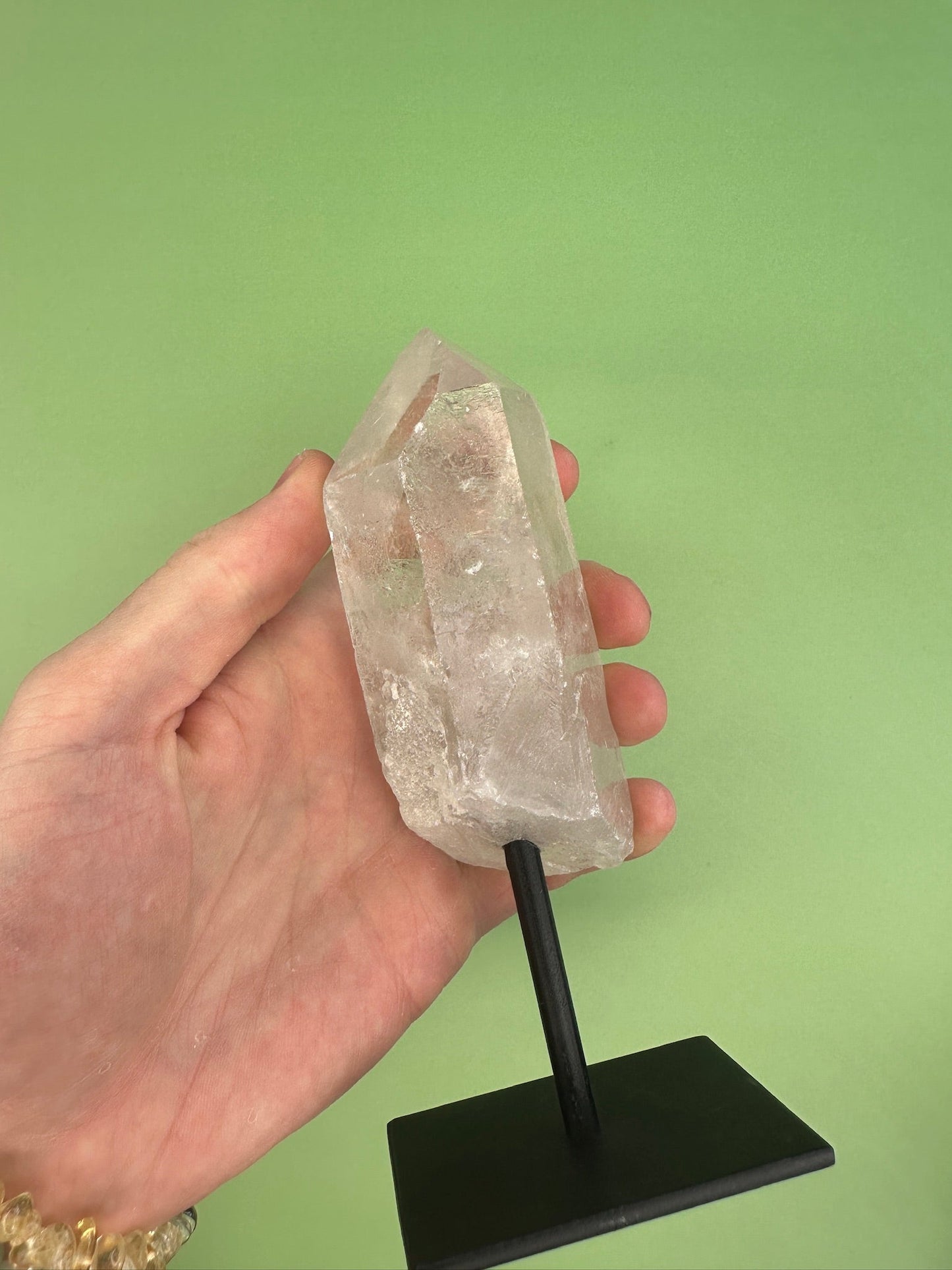 Clear quartz - Rough point on a stand
