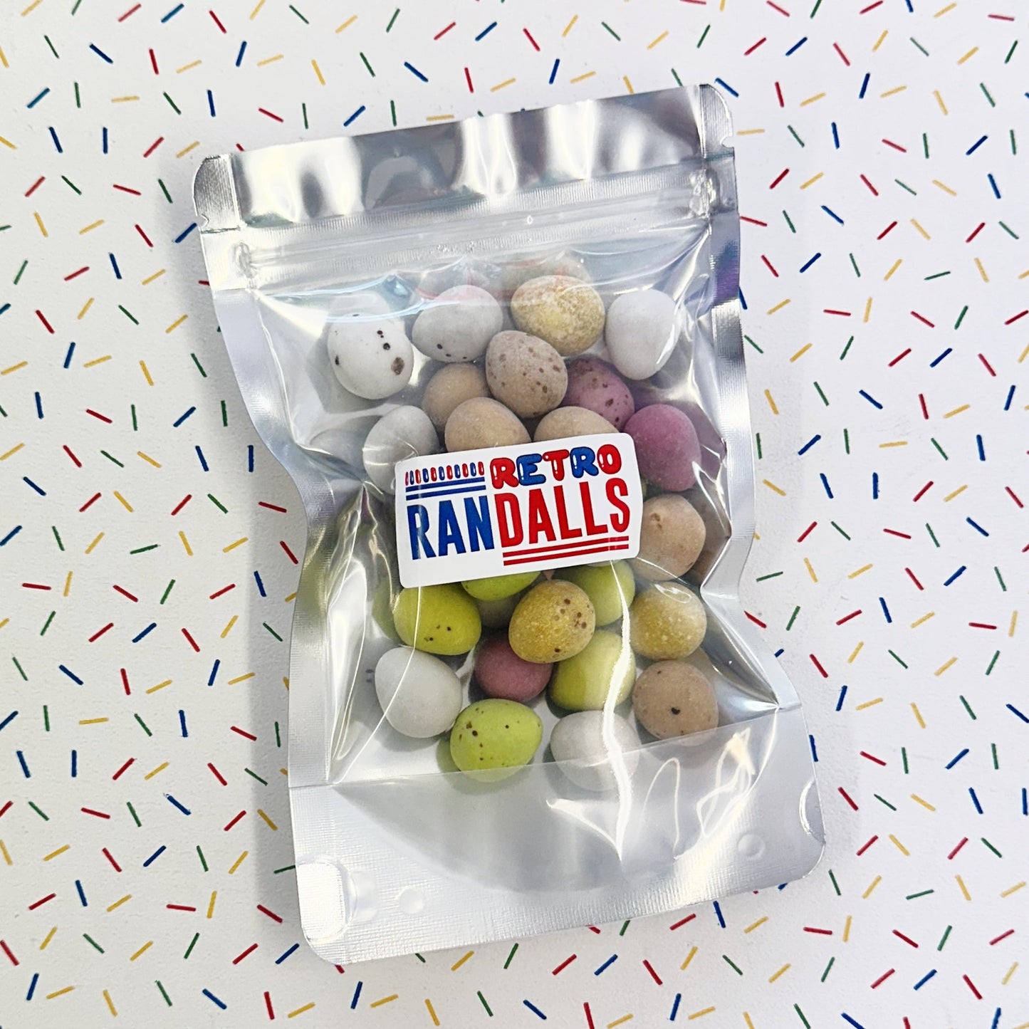 GLISTEN MINI EGGS - 100g (BRITISH)