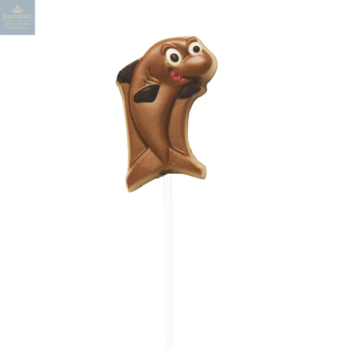 Hand decorated chocolate shark lollipops in display