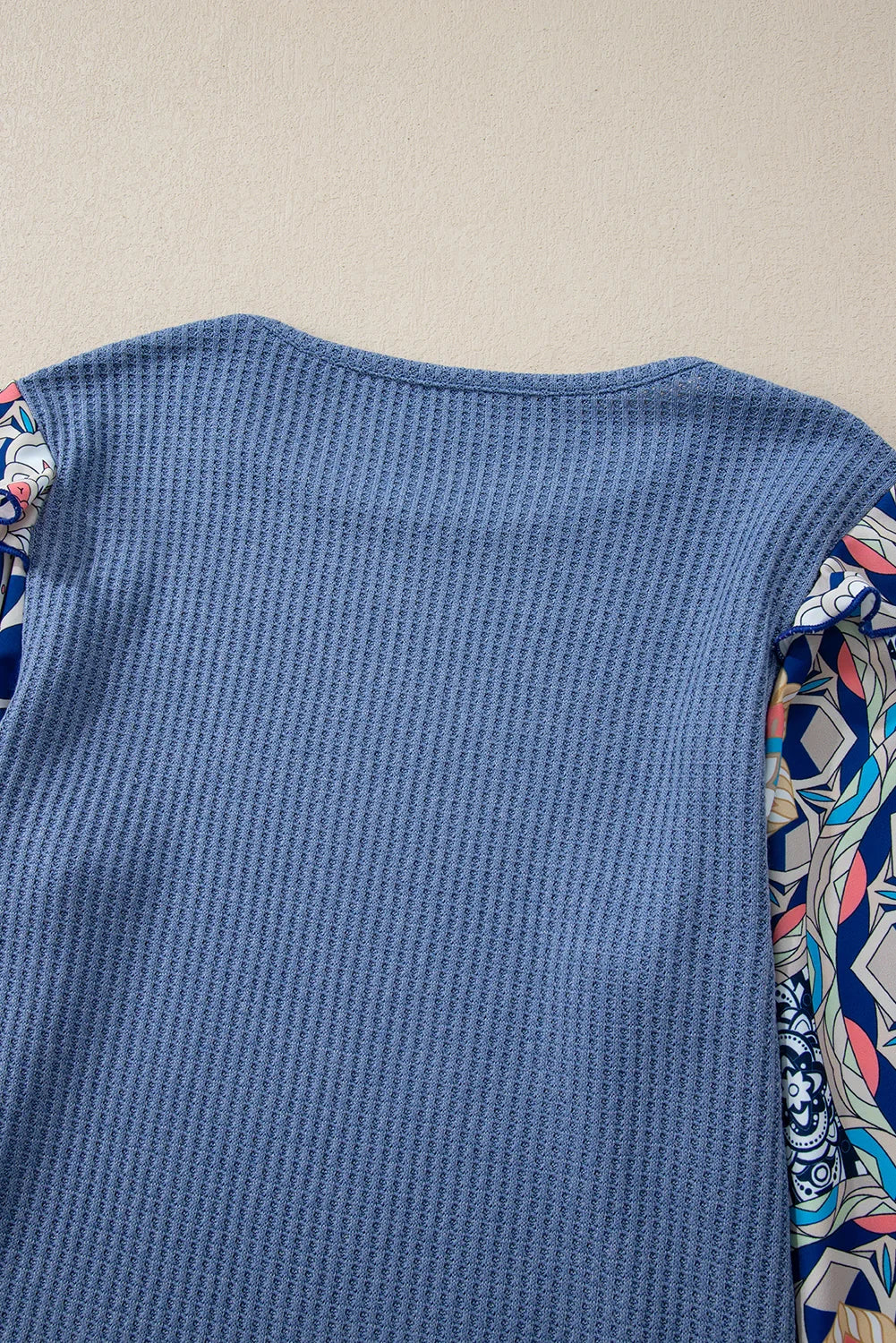 Blue O-Neck Waffle Knit Blouse with Floral Sleeves and Ruffles