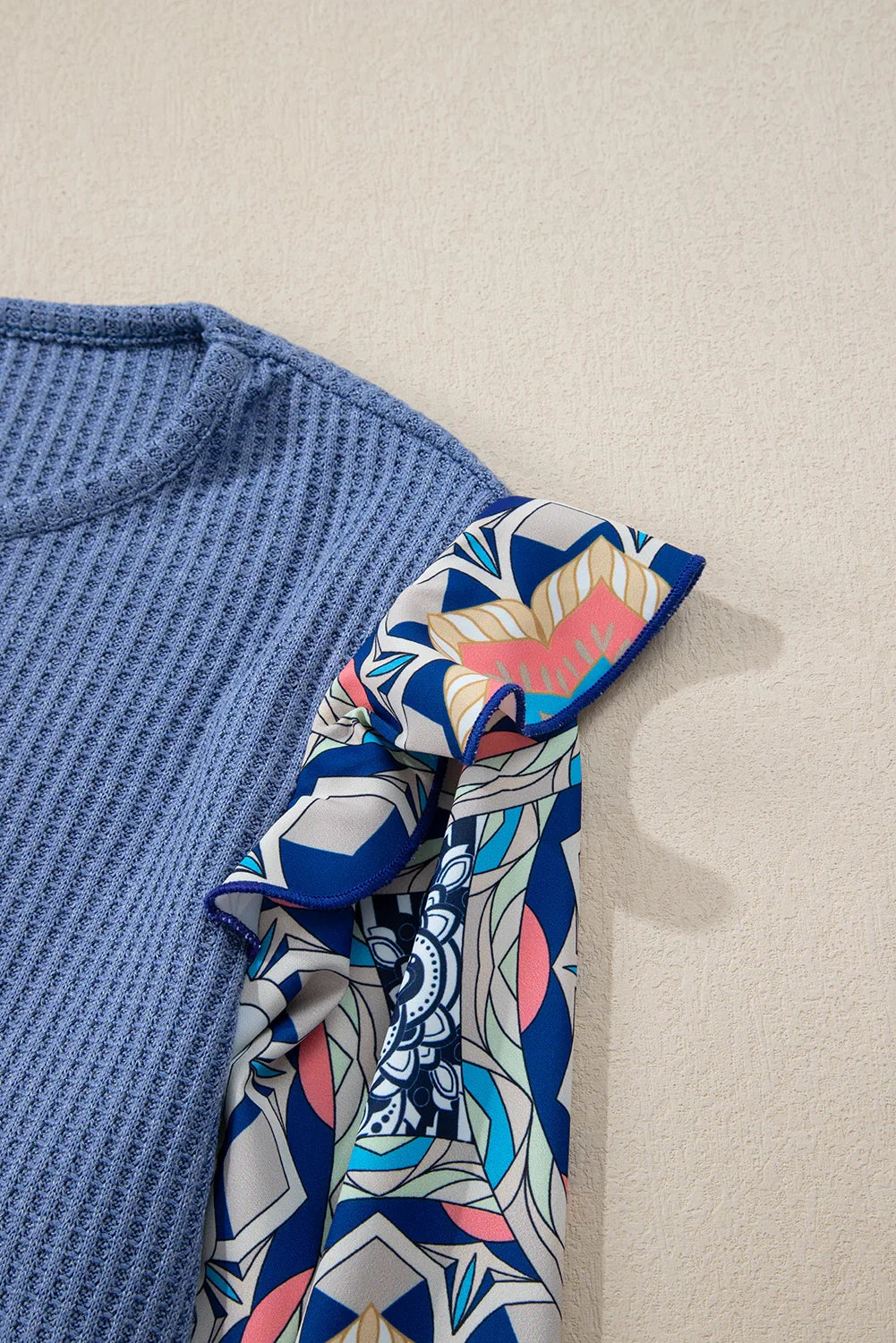 Blue O-Neck Waffle Knit Blouse with Floral Sleeves and Ruffles