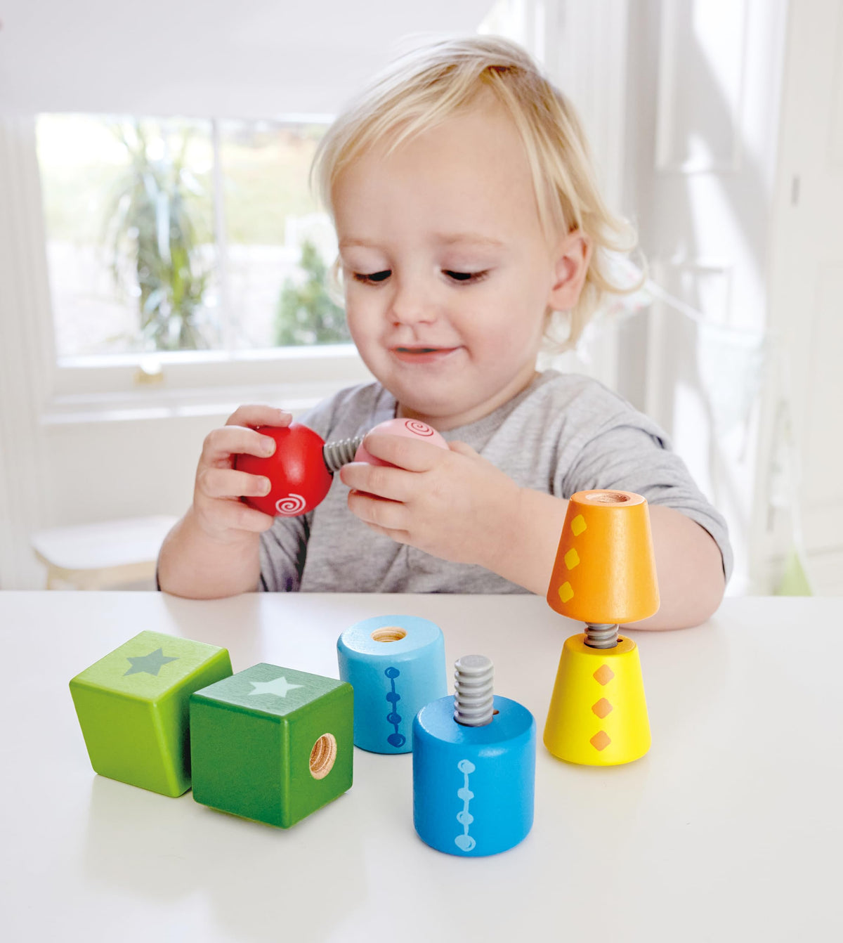 Hape Twist and Turnables Wooden Building Block Learning Set – Colorful Screw-Together Shapes for Ages 2–4