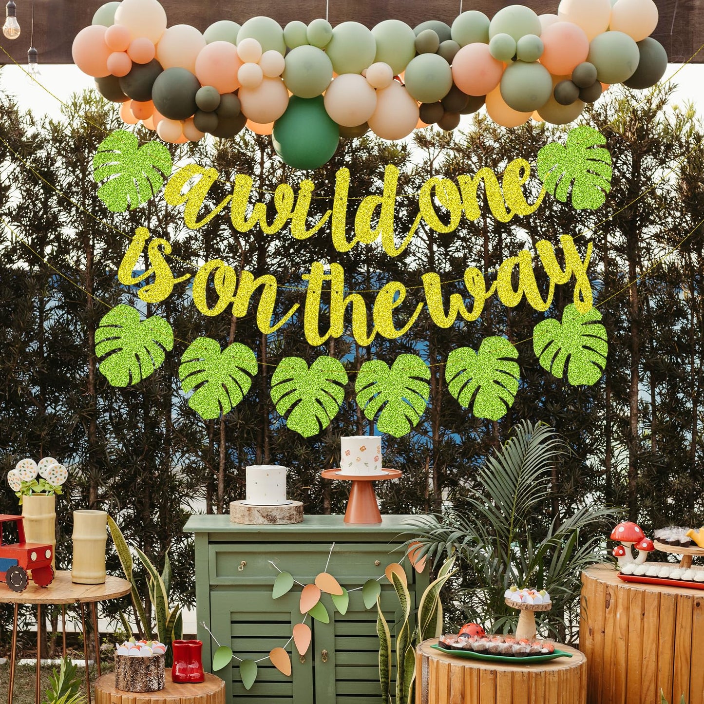 Merriva A Wild One Is On The Way Banner with Green Leaf Garland | Jungle Safari Baby Shower Decor