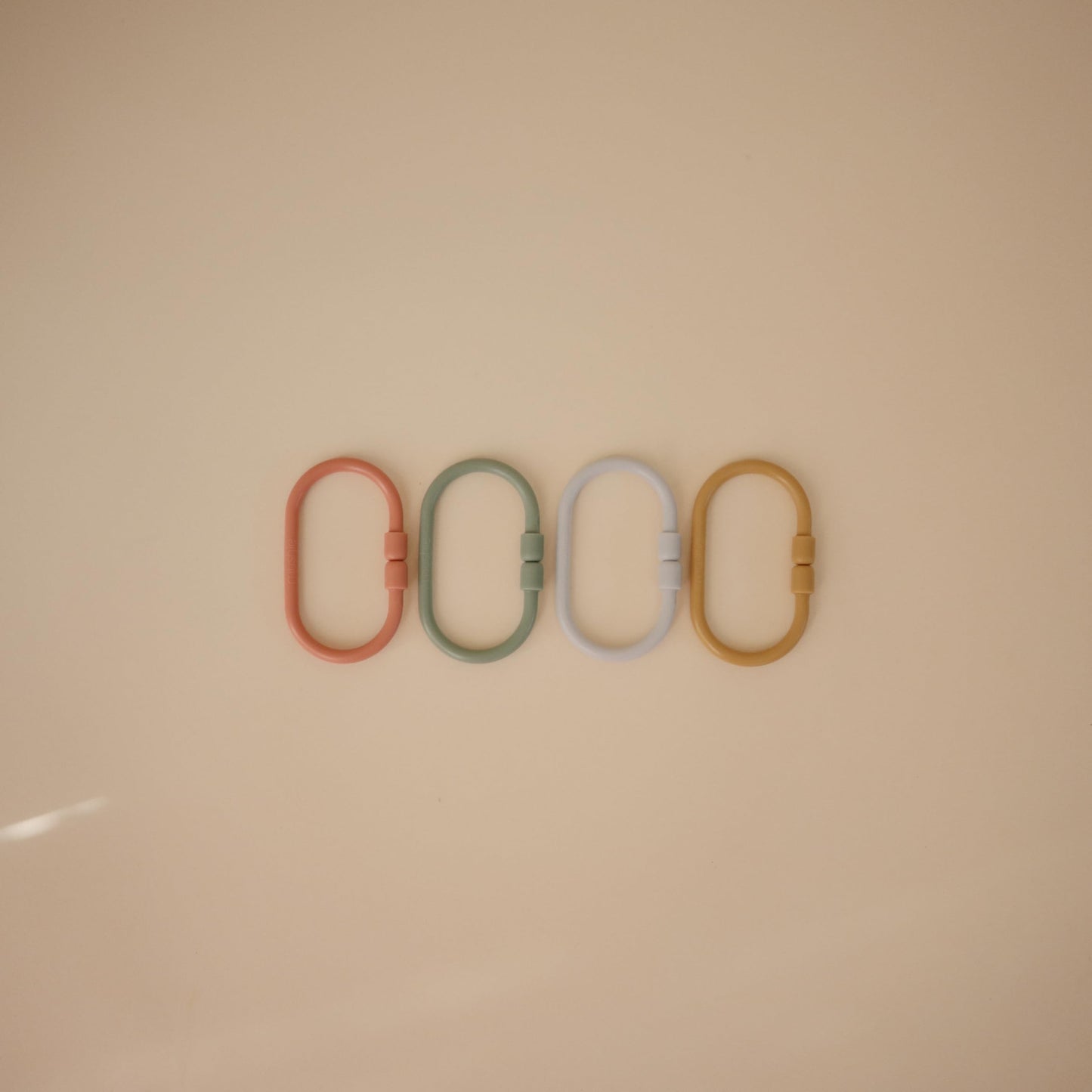 Mushie Chain Link Rings Toy 12-Pack – Car Seat & Stroller Attachments (Periwinkle, Mustard, Green, Coral)