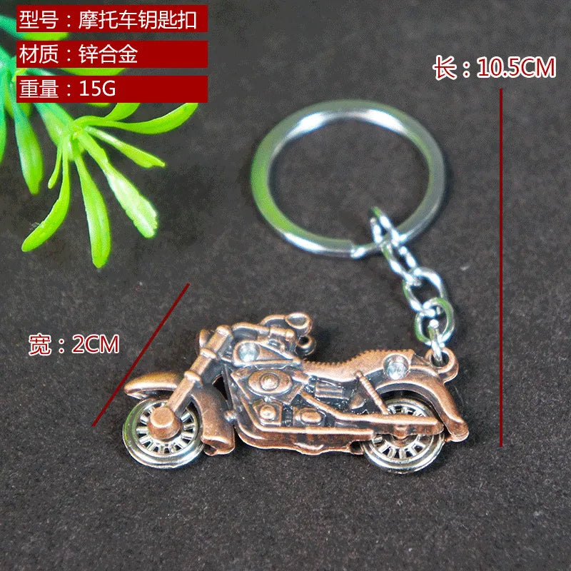 Factory sales metal simulation shell pistol tank aircraft hammer Bell ear spoon keychain uncle souvenir