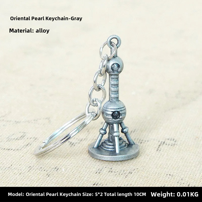 Factory sales metal simulation shell pistol tank aircraft hammer Bell ear spoon keychain uncle souvenir