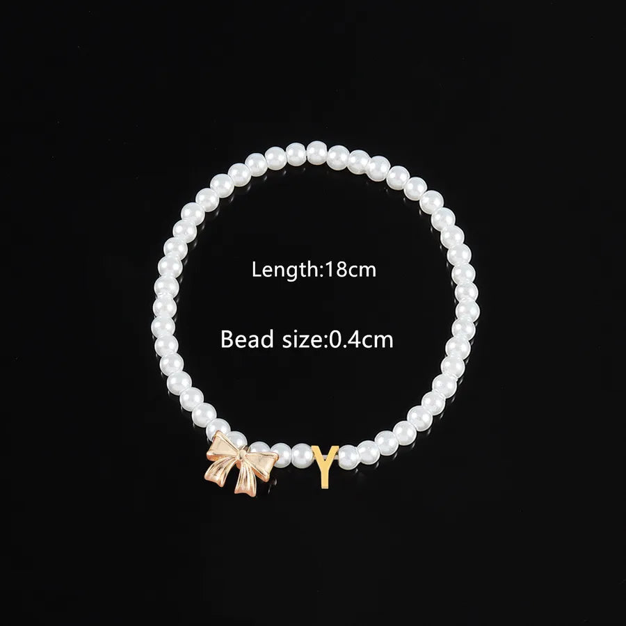 Elegant Classic Style Letter Bow Knot 304 Stainless Steel Artificial Pearl Copper Beaded Chain Beaded Bracelets Wholesale