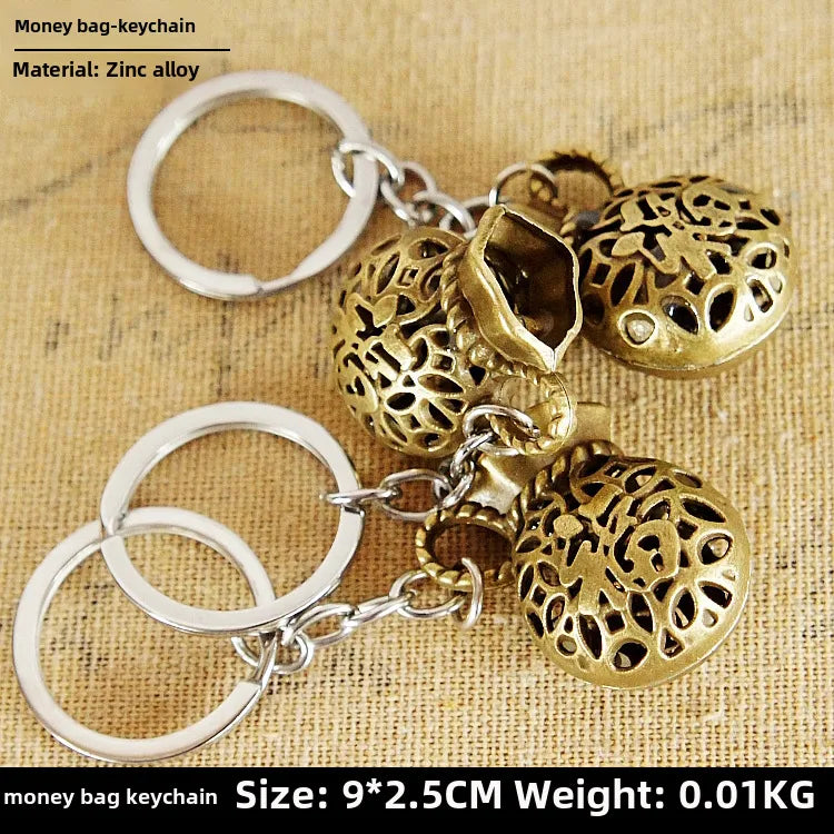 Factory sales metal simulation shell pistol tank aircraft hammer Bell ear spoon keychain uncle souvenir