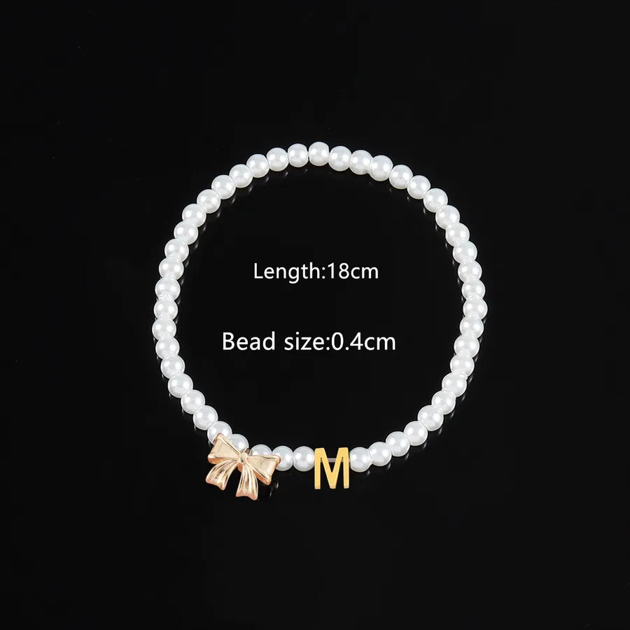 Elegant Classic Style Letter Bow Knot 304 Stainless Steel Artificial Pearl Copper Beaded Chain Beaded Bracelets Wholesale
