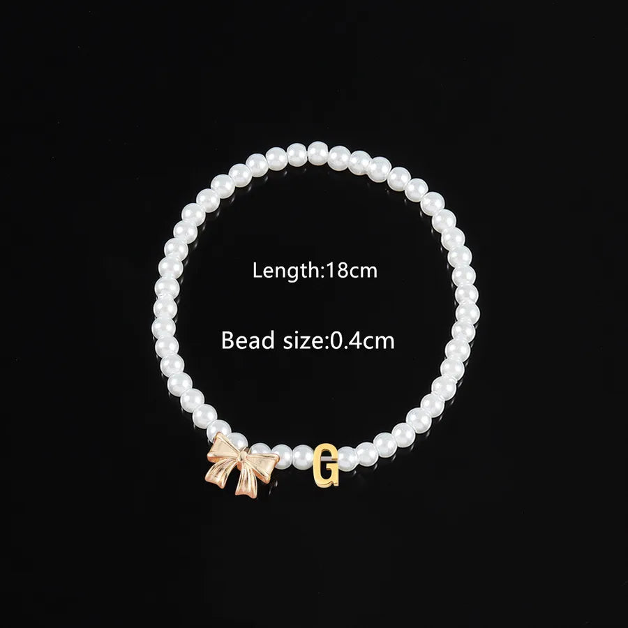Elegant Classic Style Letter Bow Knot 304 Stainless Steel Artificial Pearl Copper Beaded Chain Beaded Bracelets Wholesale