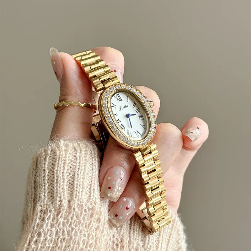 Elegantly Crafted Roman Steel Band Quartz Watch For Women Small Dial Oval Shape Diamond Embedded Fashionable Timepiece