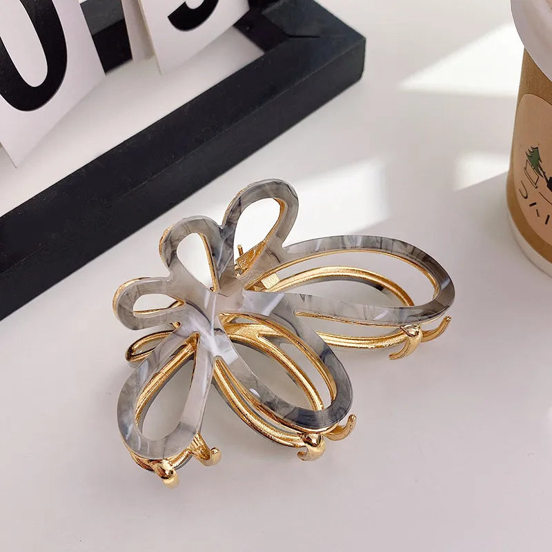 Women's Simple Style Butterfly Acetic acid sheets Hollow Out Hair Claws