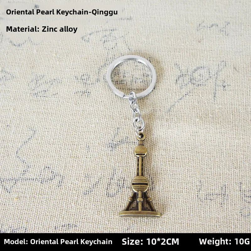 Factory sales metal simulation shell pistol tank aircraft hammer Bell ear spoon keychain uncle souvenir
