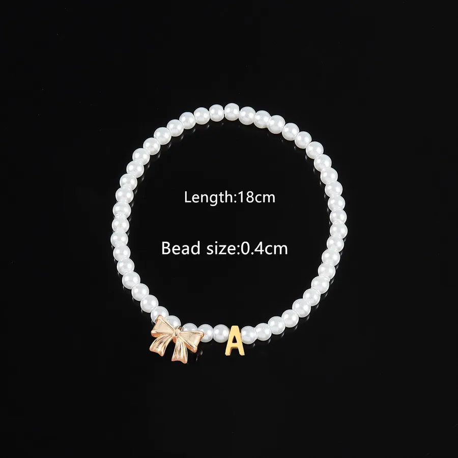 Elegant Classic Style Letter Bow Knot 304 Stainless Steel Artificial Pearl Copper Beaded Chain Beaded Bracelets Wholesale