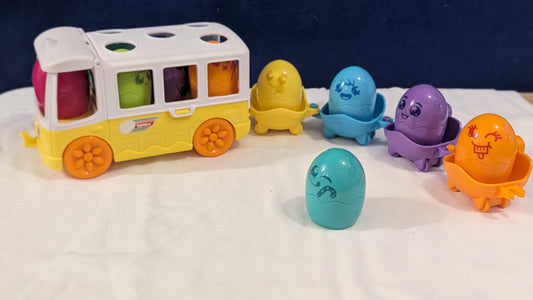 Tomy Toomies Hide n Squeak Egg Bus With Trailer