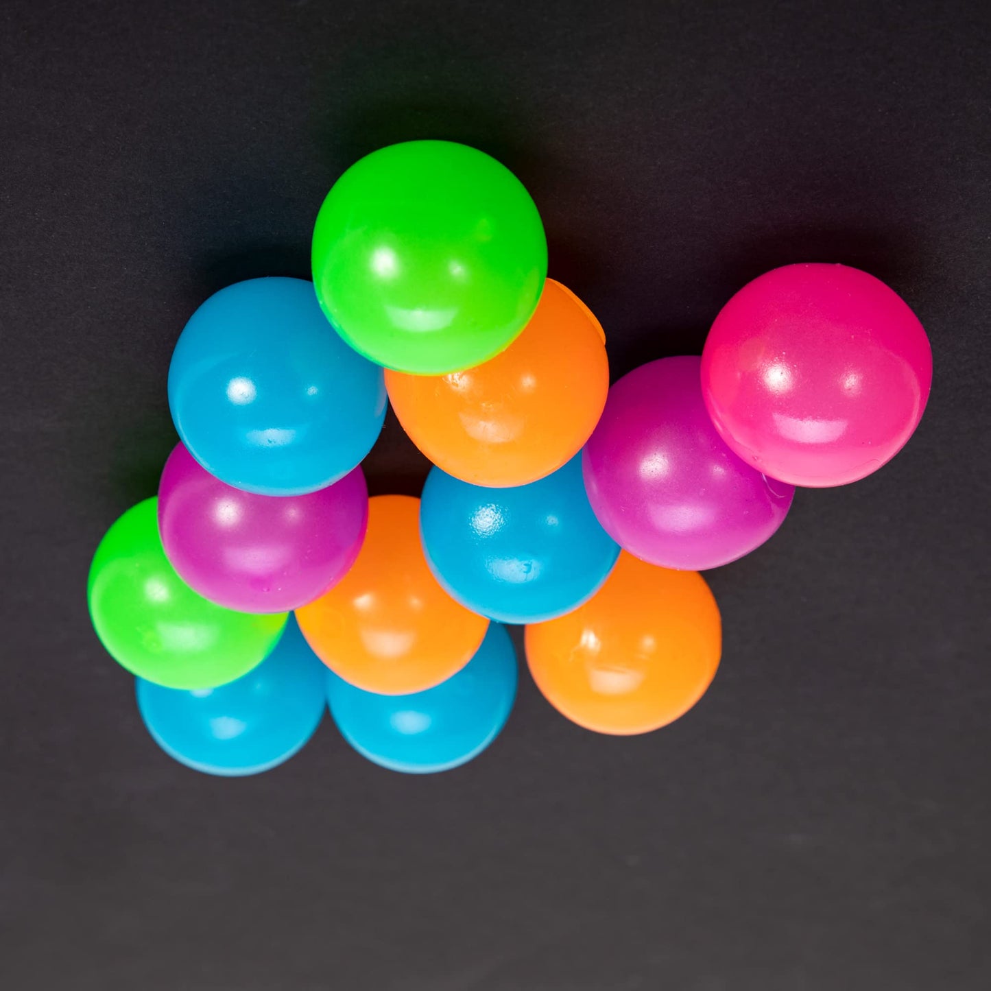 Schylling NeeDoh Stickums – Glow Sensory Squeeze Toy, Sticky Surface, 1.5in Wide (Color May Vary) – Pack of 1