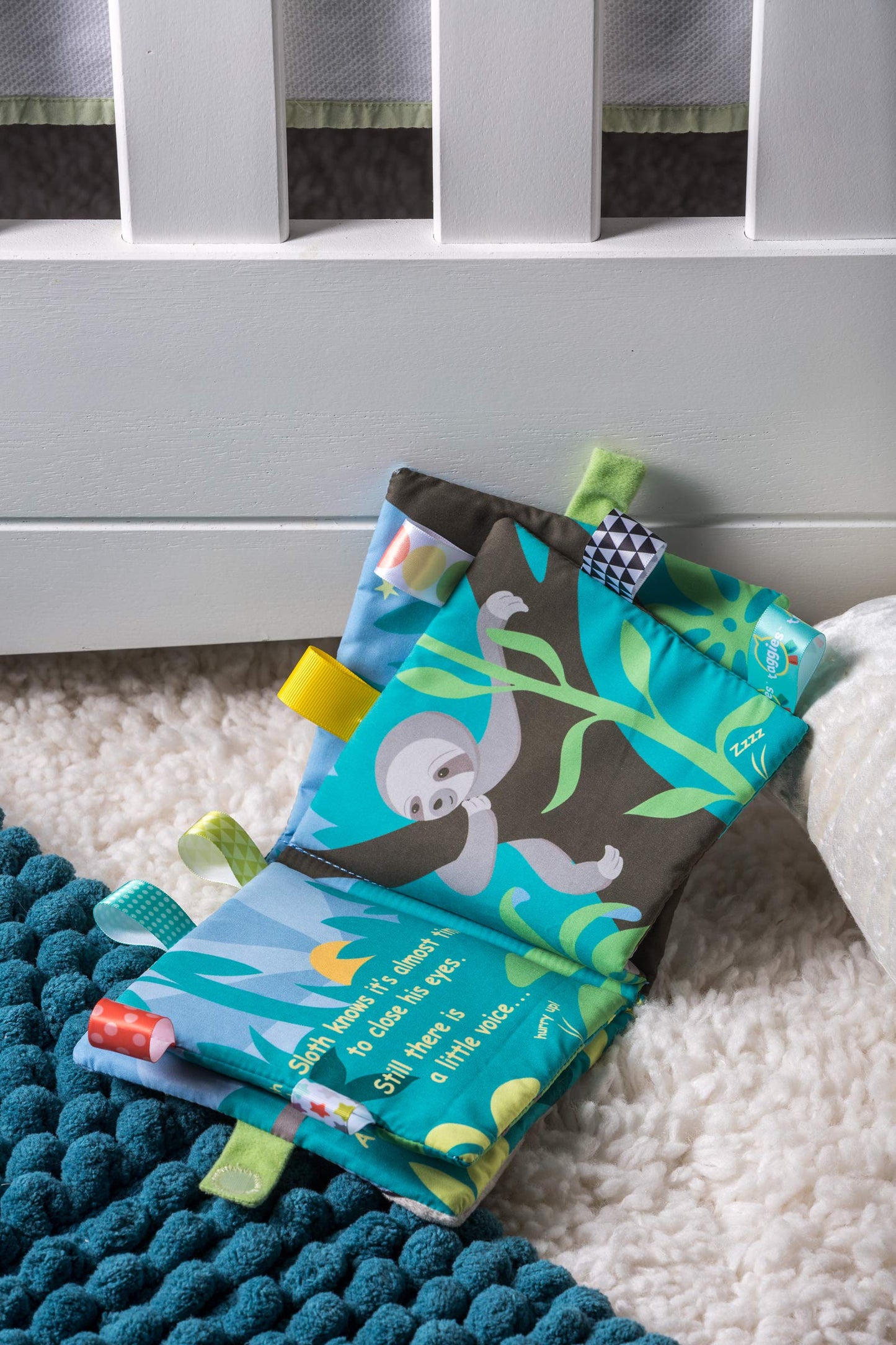 Taggies Touch & Feel Soft Cloth Book with Crinkle Paper & Squeaker — Molasses Sloth | Mary Meyer