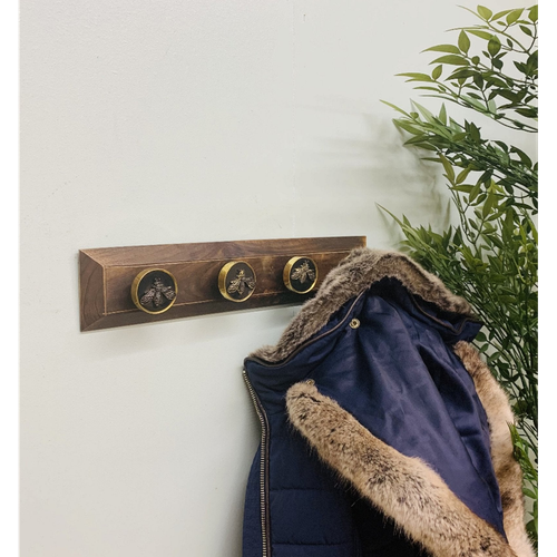 Four Bee Design Coat Knobs On A Wooden Base