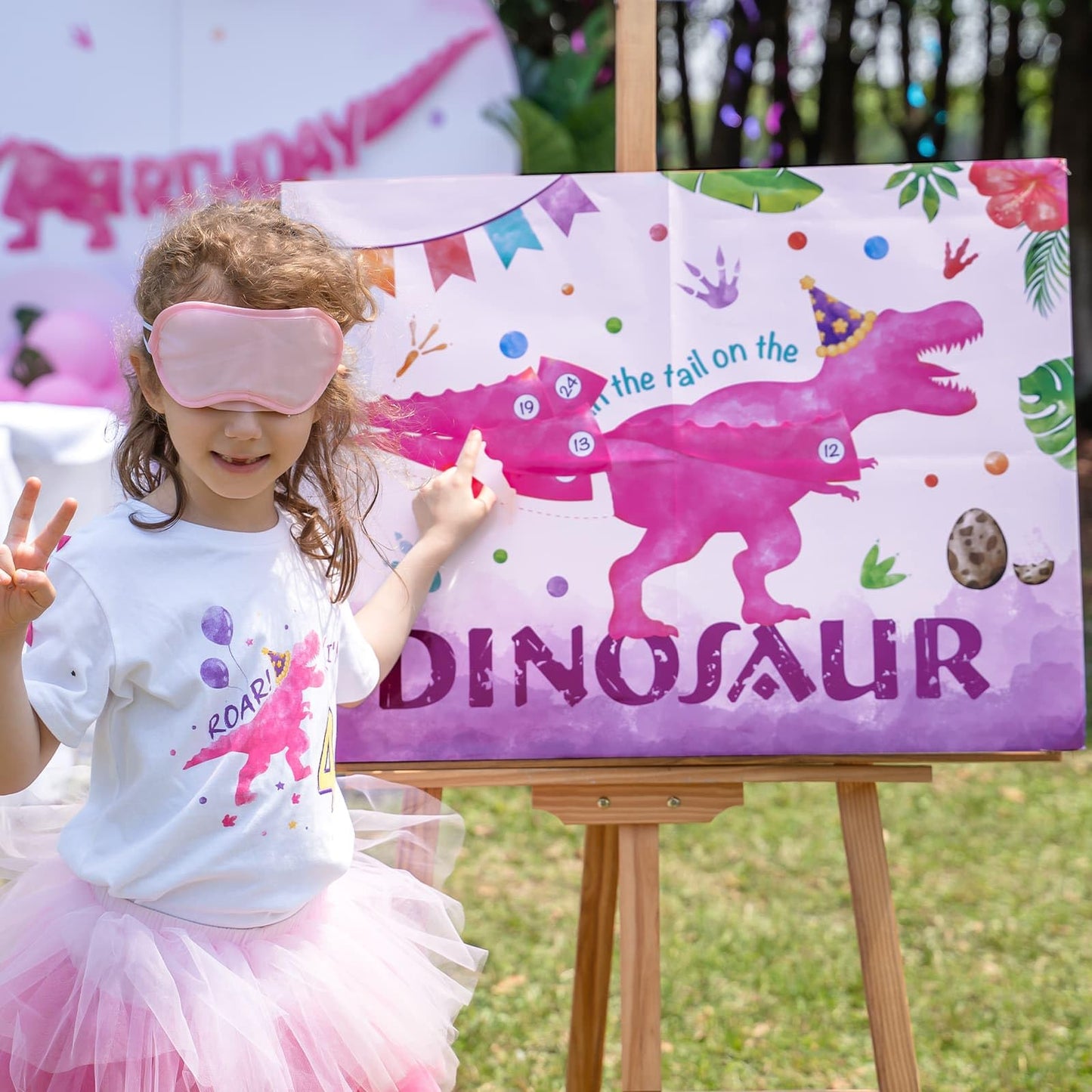 WERNNSAI Pin The Tail on The Dinosaur Game – 28-inch Poster Kit with Blindfold, 24 Pink Tails & 20 Dots